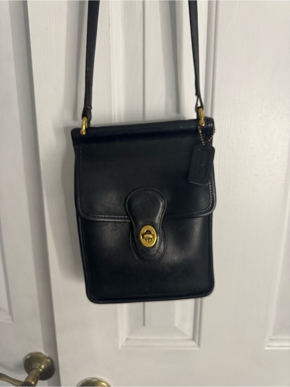 Coach Vintage Black Leather Crossbody Bag with Turn-Lock Closure